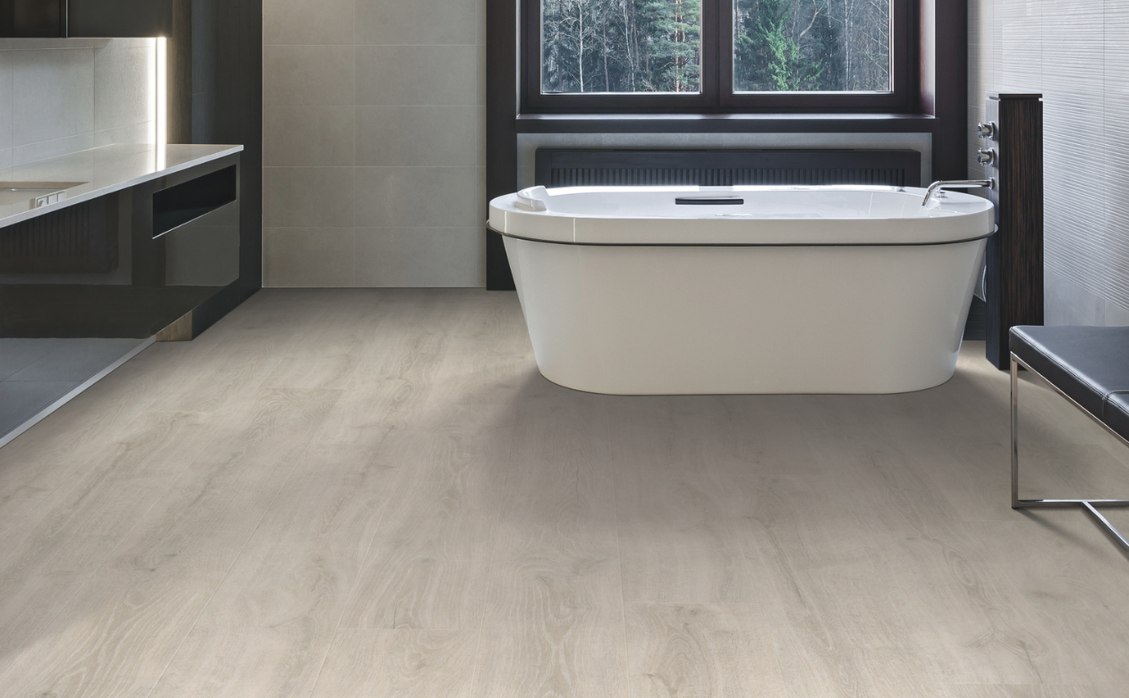 Bathroom with wood-look laminate floors with a bathtub